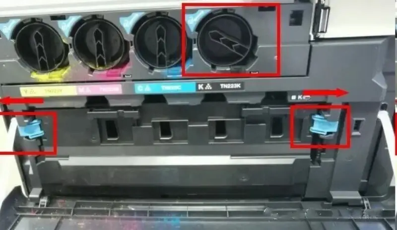 Removing the waste toner container from a Konica Minolta drum unit